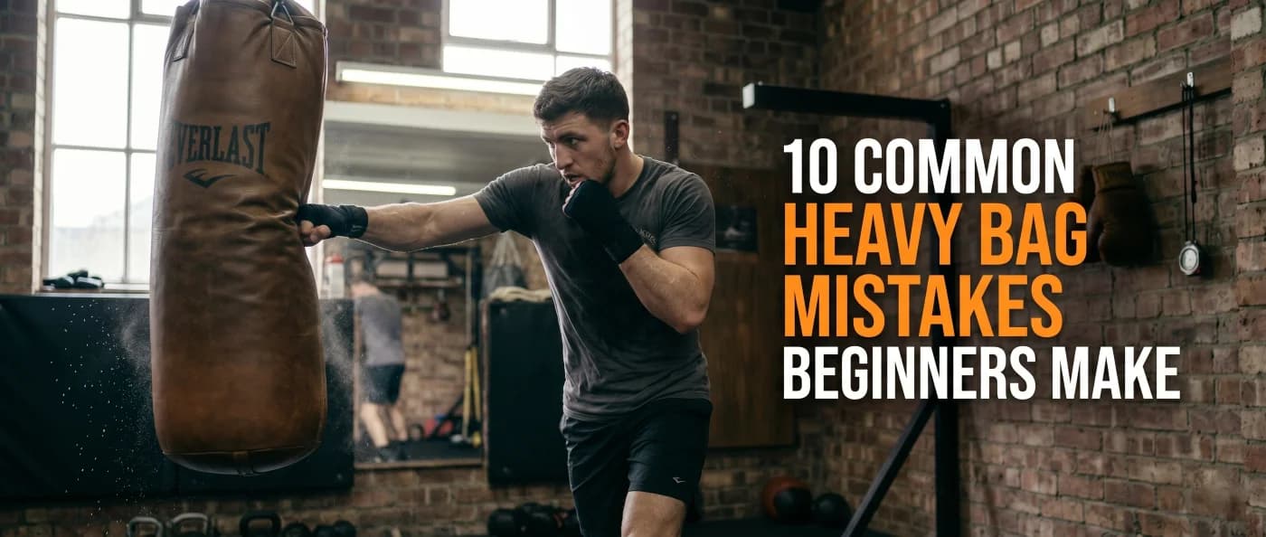 Beginner boxer making mistakes during heavy bag training session.
